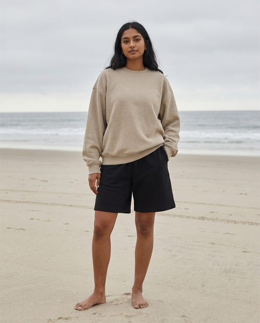 Model wearing Gilded Streets Heavyweight Fleece Shorts, coastal editorial look