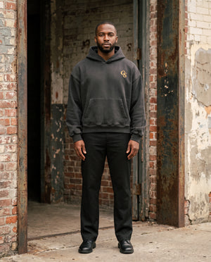 Male model wearing the Vintage Wash Boxy Fleece Hoodie in Black
