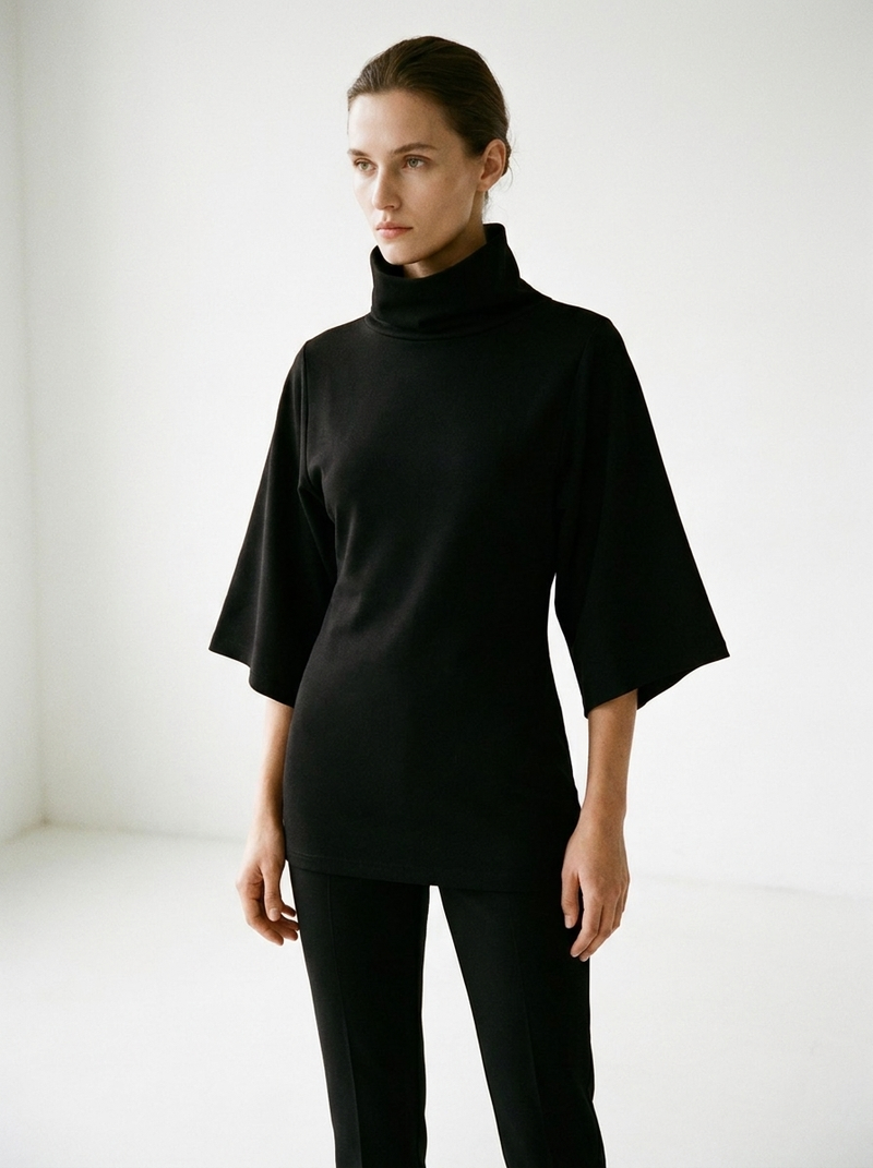 Model wearing Gilded Streets Women's Turtleneck Batwing Tee, editorial