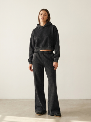 Model wearing the Mineral Wash Crop Hoodie with the Mineral Wash Flared Leg Sweatpant
